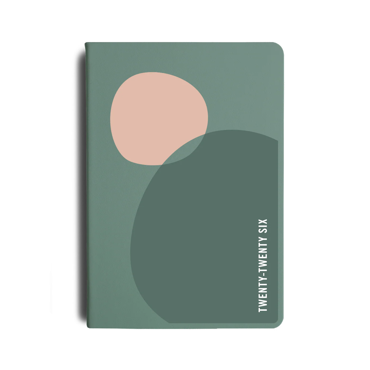 Green notebook with abstract shapes and 'TWENTY-TWENTY' text on a white background
