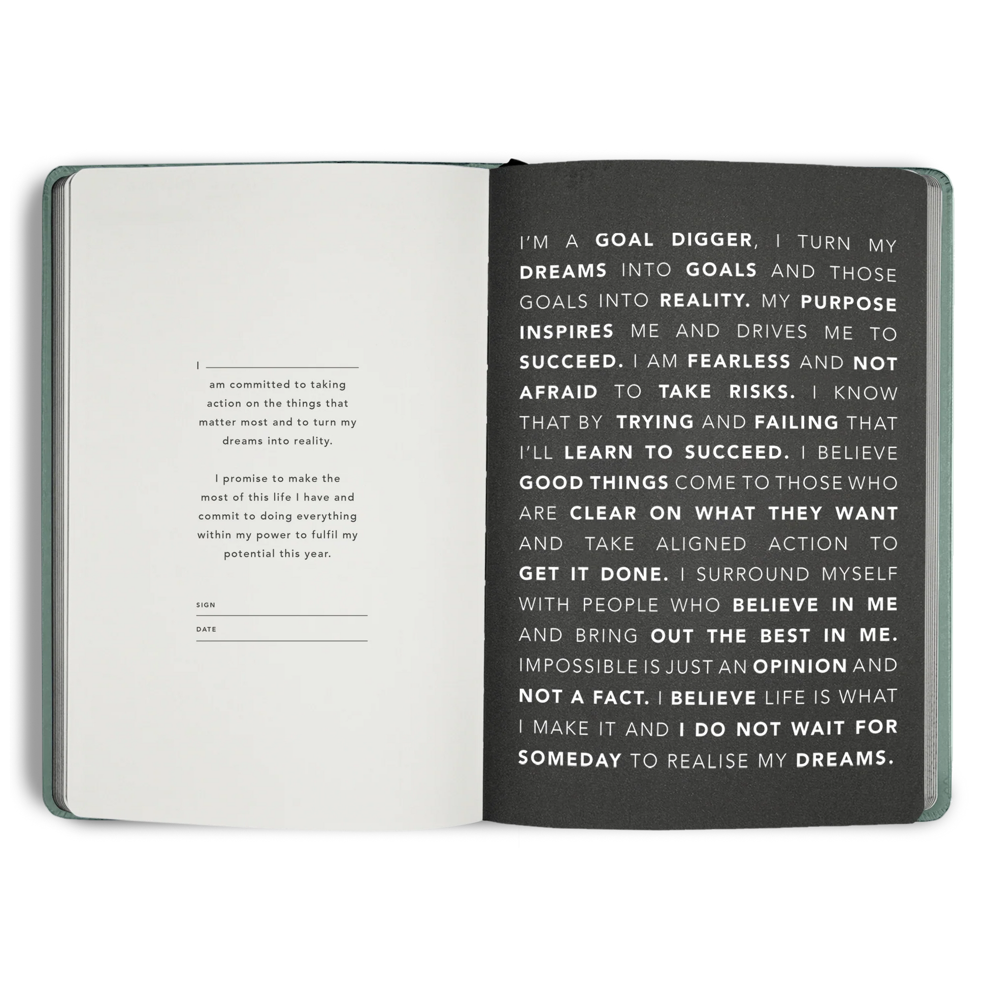 Open notebook with motivational text on a white background