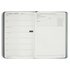 Open planner with weekly schedule and notes section on a white background