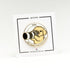 A circular enamel pin featuring a small dog holding a camera, with the text 'YOU ARE BEING PHOTOGRAPHED' around it, mounted on a white display card. The card has black border lines and text reading 'LIMITED EDITION' and 'OFFICIALEXCLUSIVE.