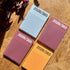 Four colorful planners labeled '2026/365' on a wooden surface.