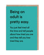 Being An Adult Is Pretty Easy. Greeting Card with text about being an adult with black writing on a green board