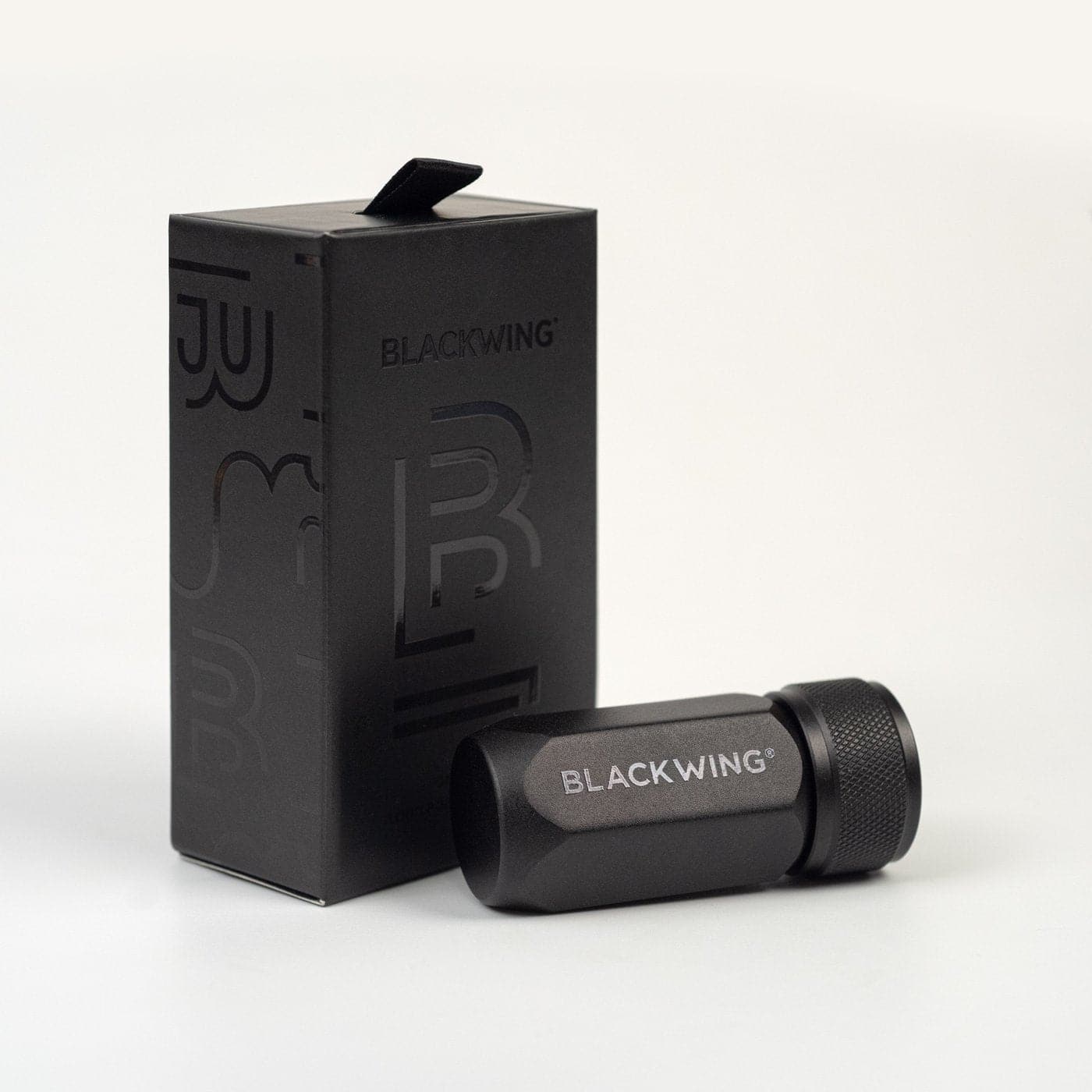 Black wing pen and packaging on a white background
