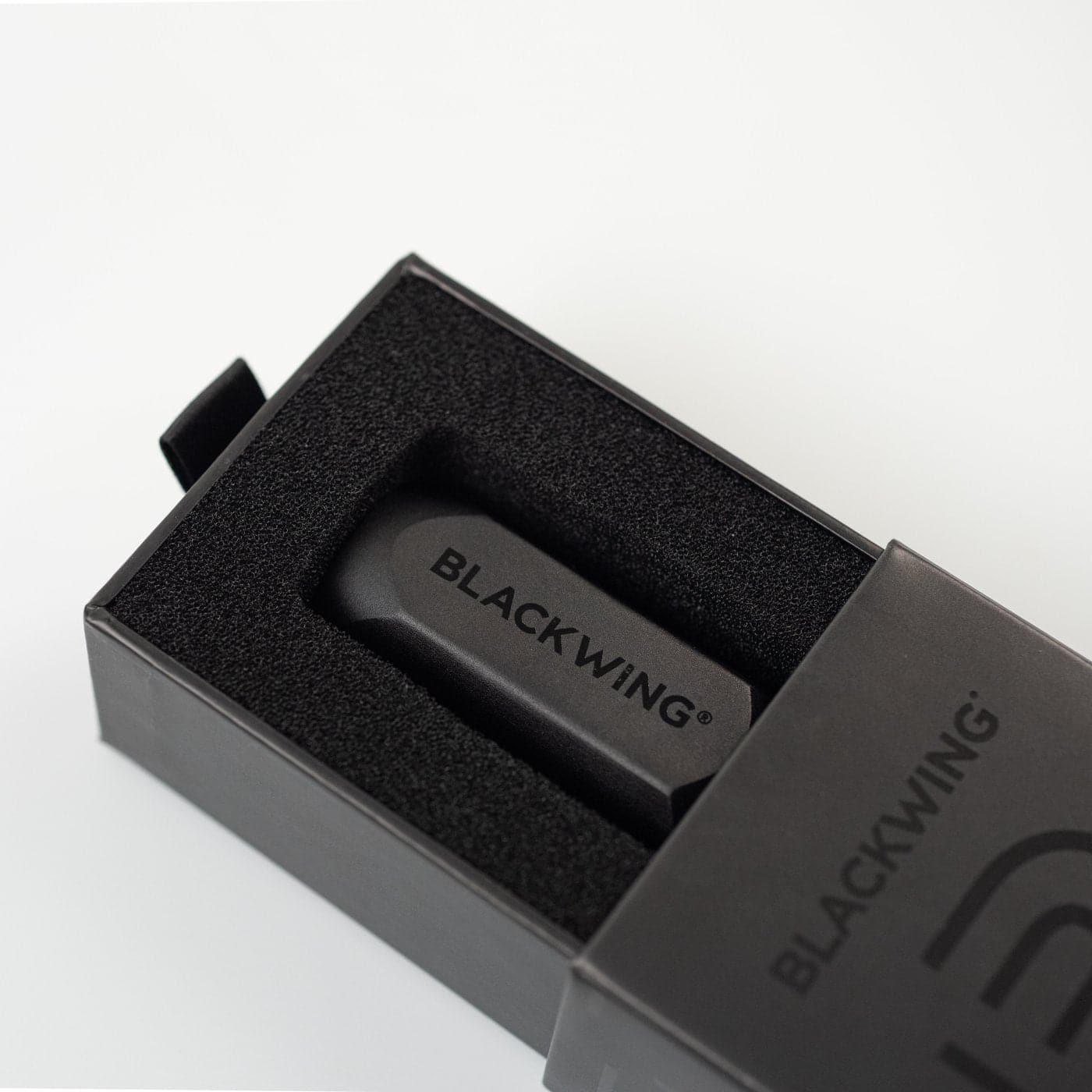Blackwing eraser in a branded black box on a white background