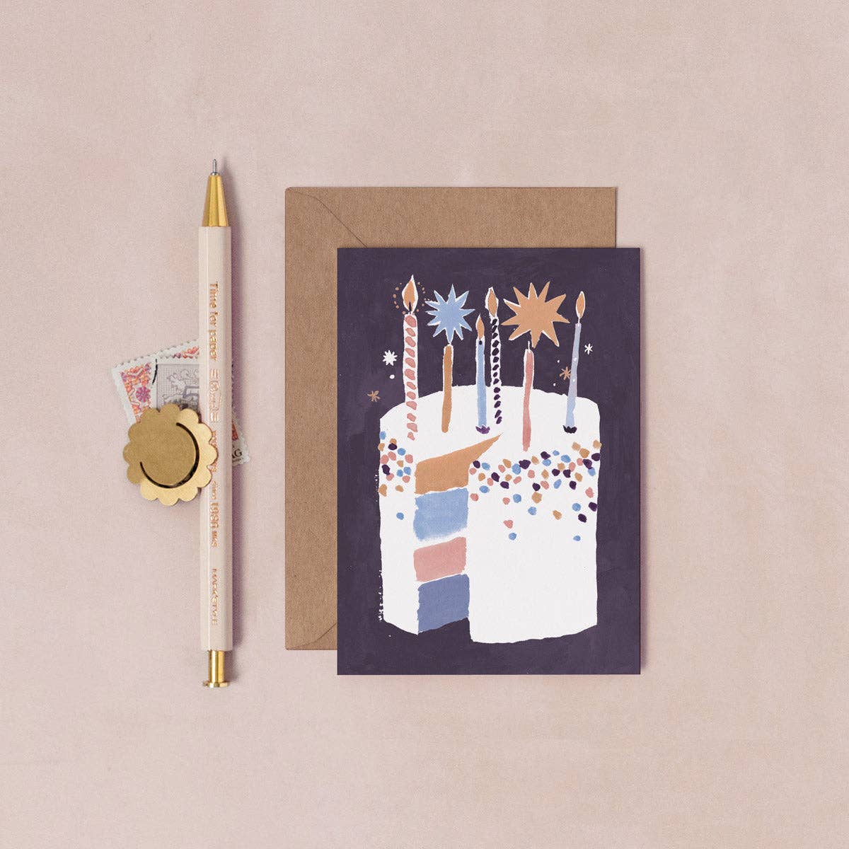 Greeting card with birthday cake illustration on a beige background