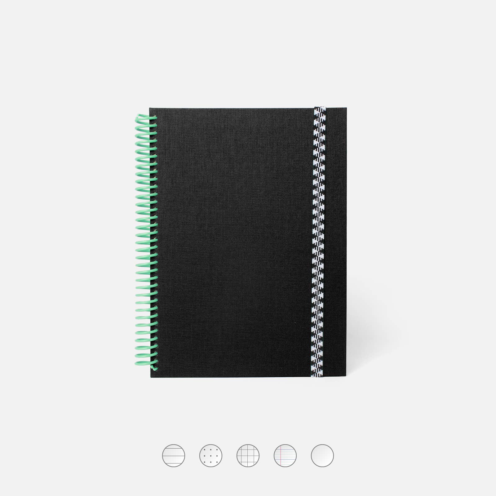 Black notebook with green and silver spiral binding on a white background