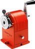 Red manual pencil sharpener with 'Caran d'Ache' branding on a white background