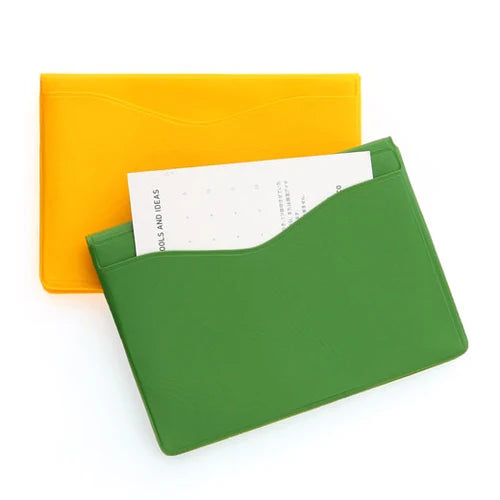 Green cardholder with a yellow background
