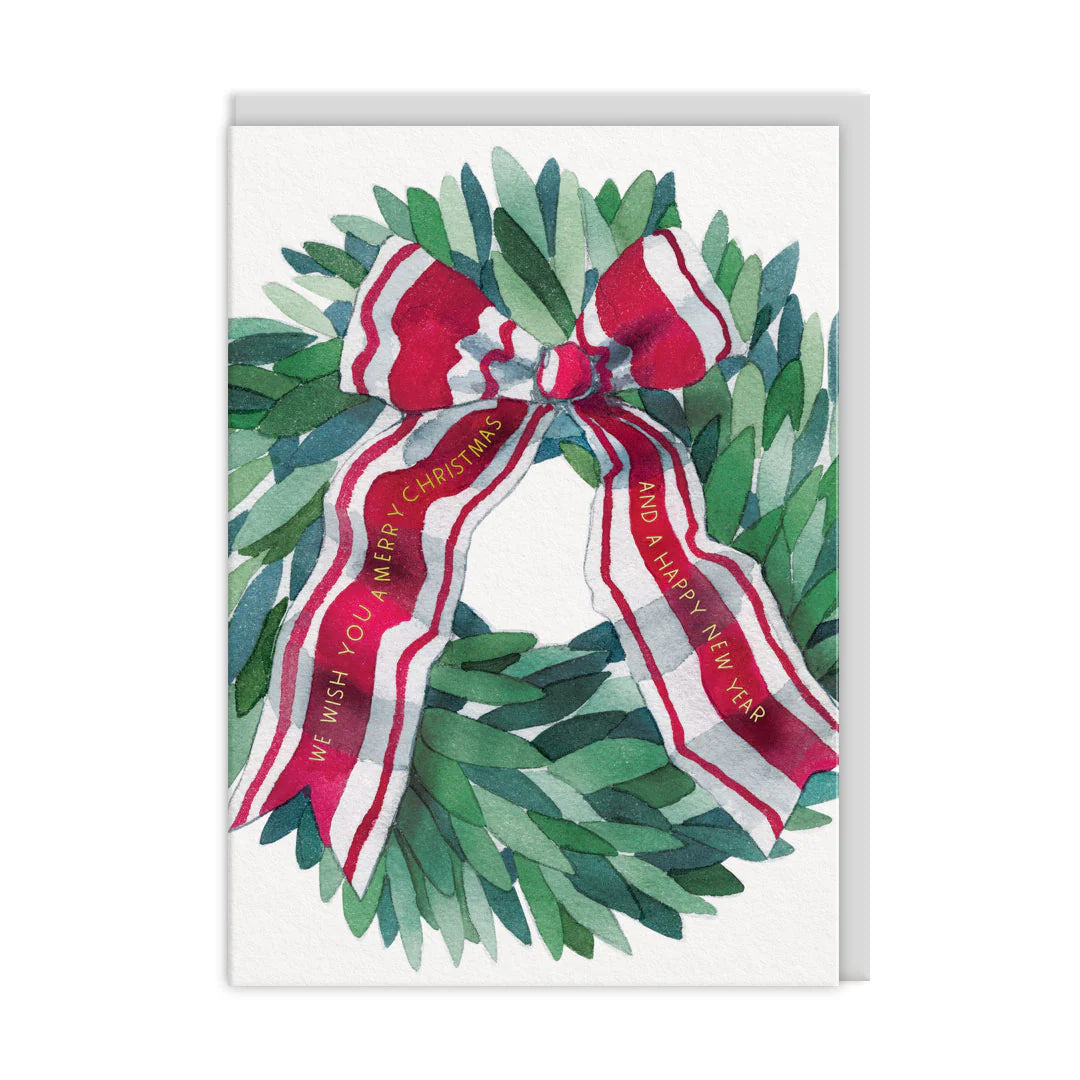 Christmas card with a green wreath and red ribbon on a white background