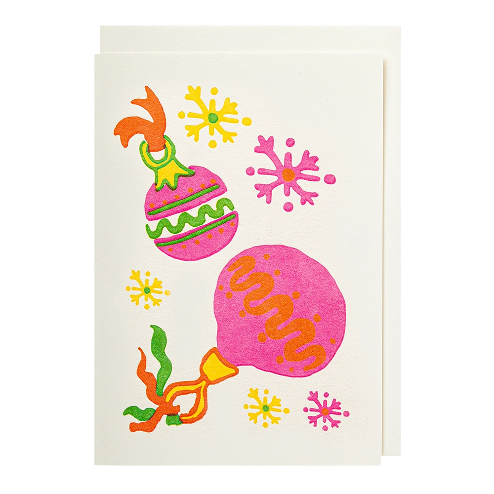 Colorful Christmas-themed card on a white card with a white background