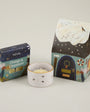 Sheval candle and packaging on a light gray background