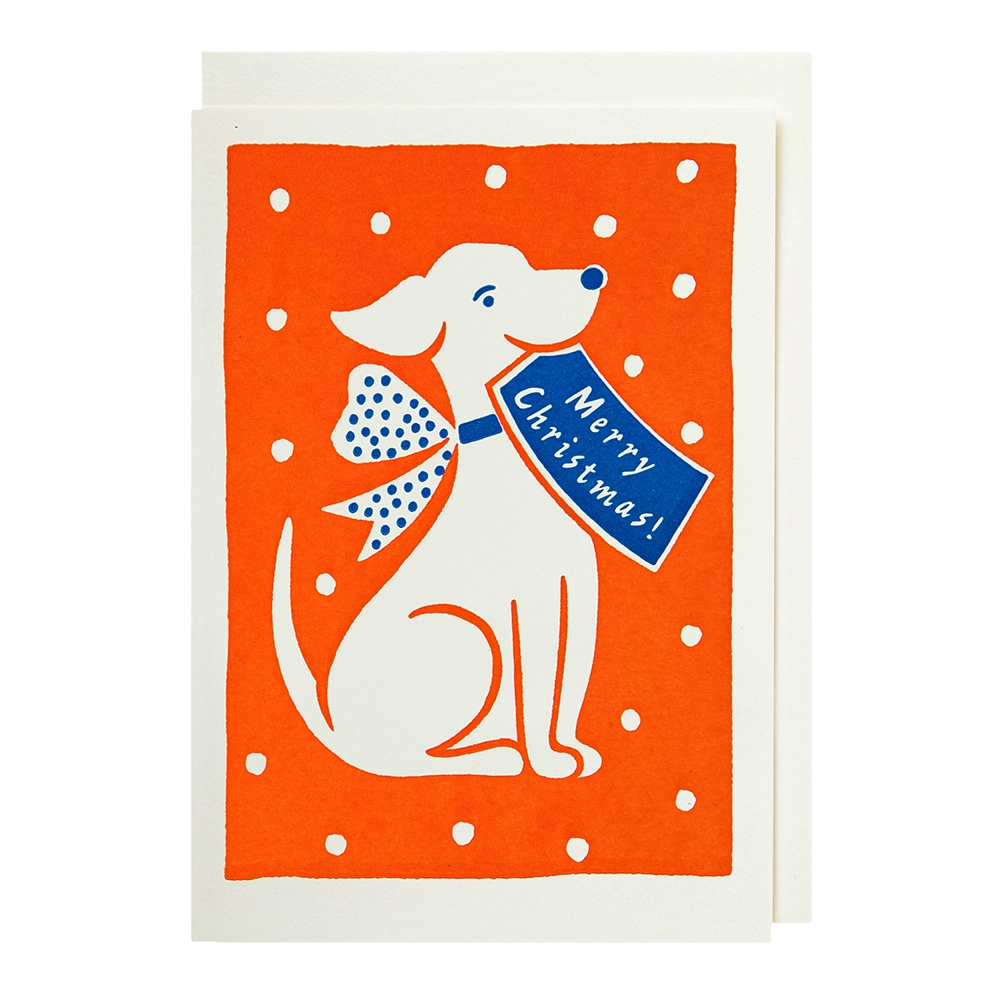 Christmas card with a white dog wearing a blue bow and holding a 'Merry Christmas!' sign on an orange background with white polka dots.