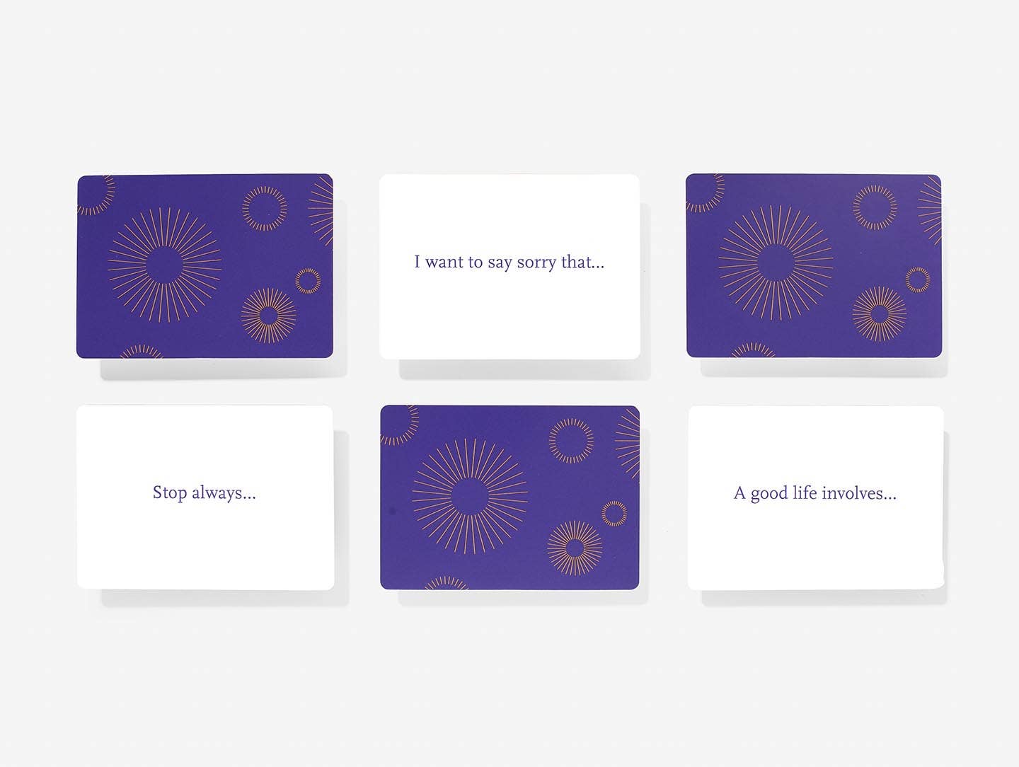 Set of cards with purple and white design on a white background