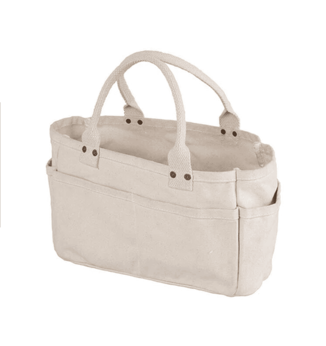 A light beige canvas organizer tote bag with two top handles and multiple front pockets, shown on a plain white background.
