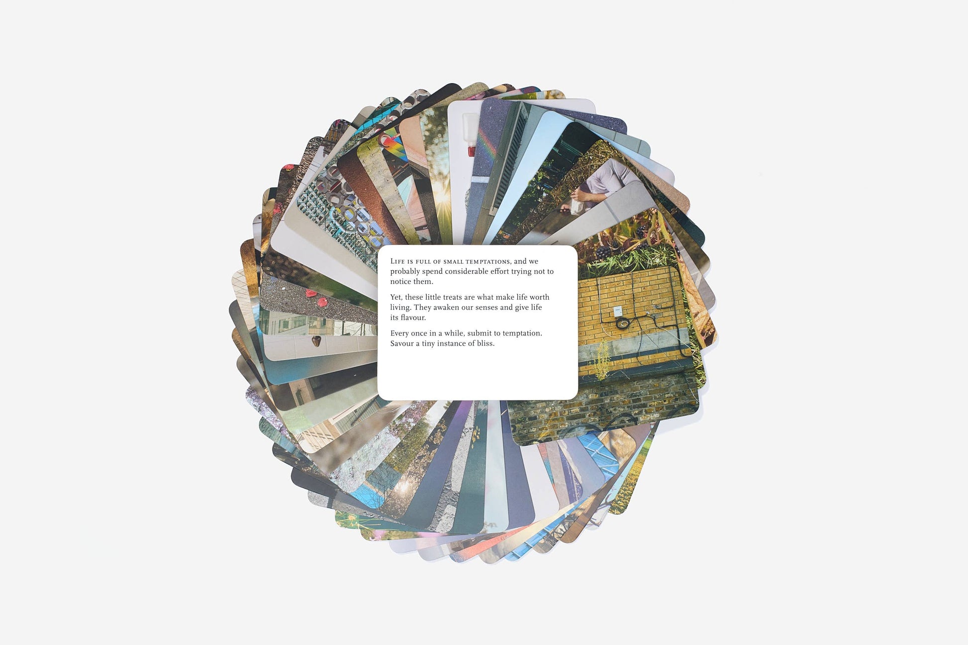 Circular arrangement of postcards with various images on a white background