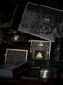 Decorative boxes with intricate designs on a dark background