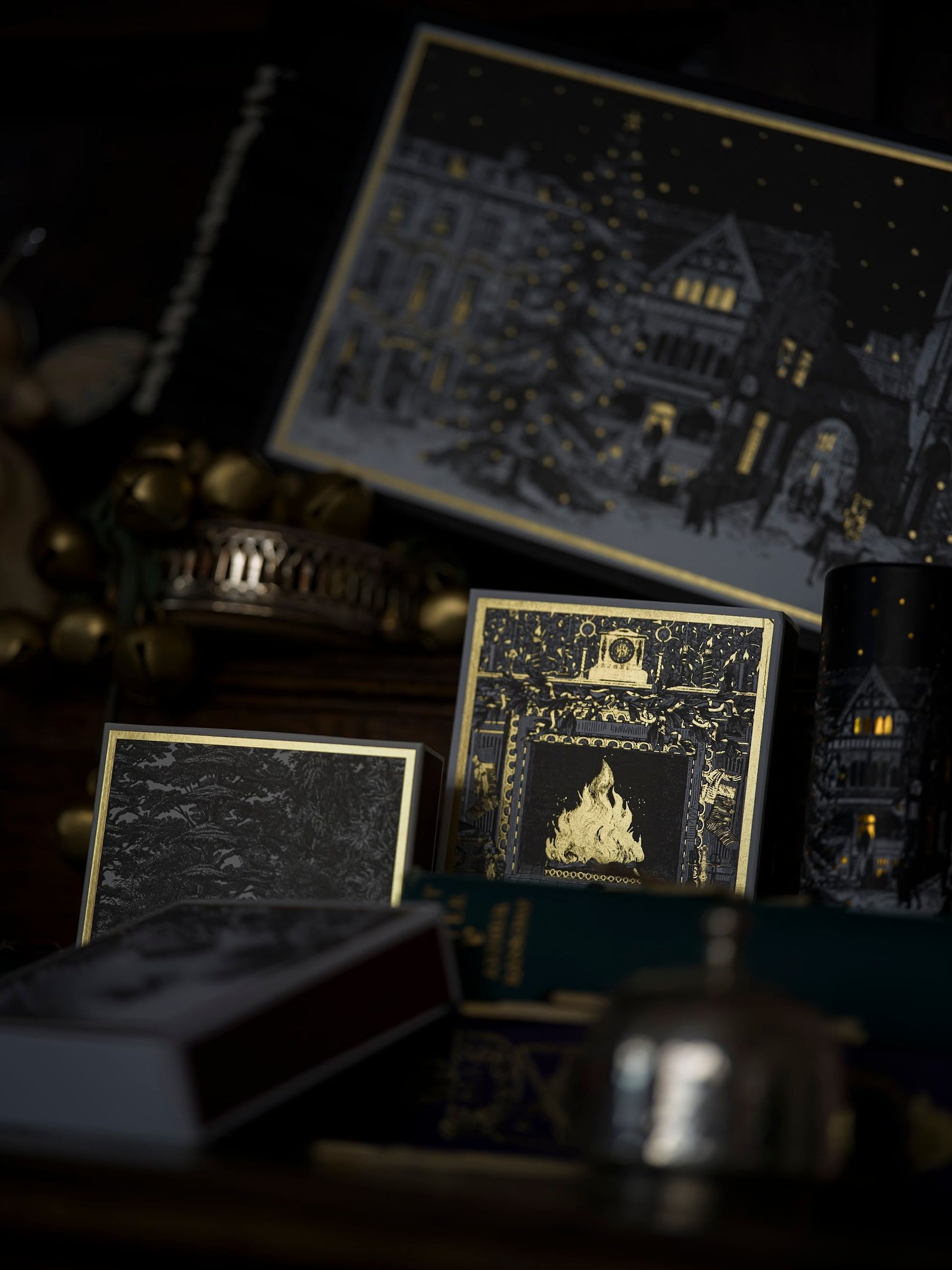 Decorative boxes with intricate designs on a dark background