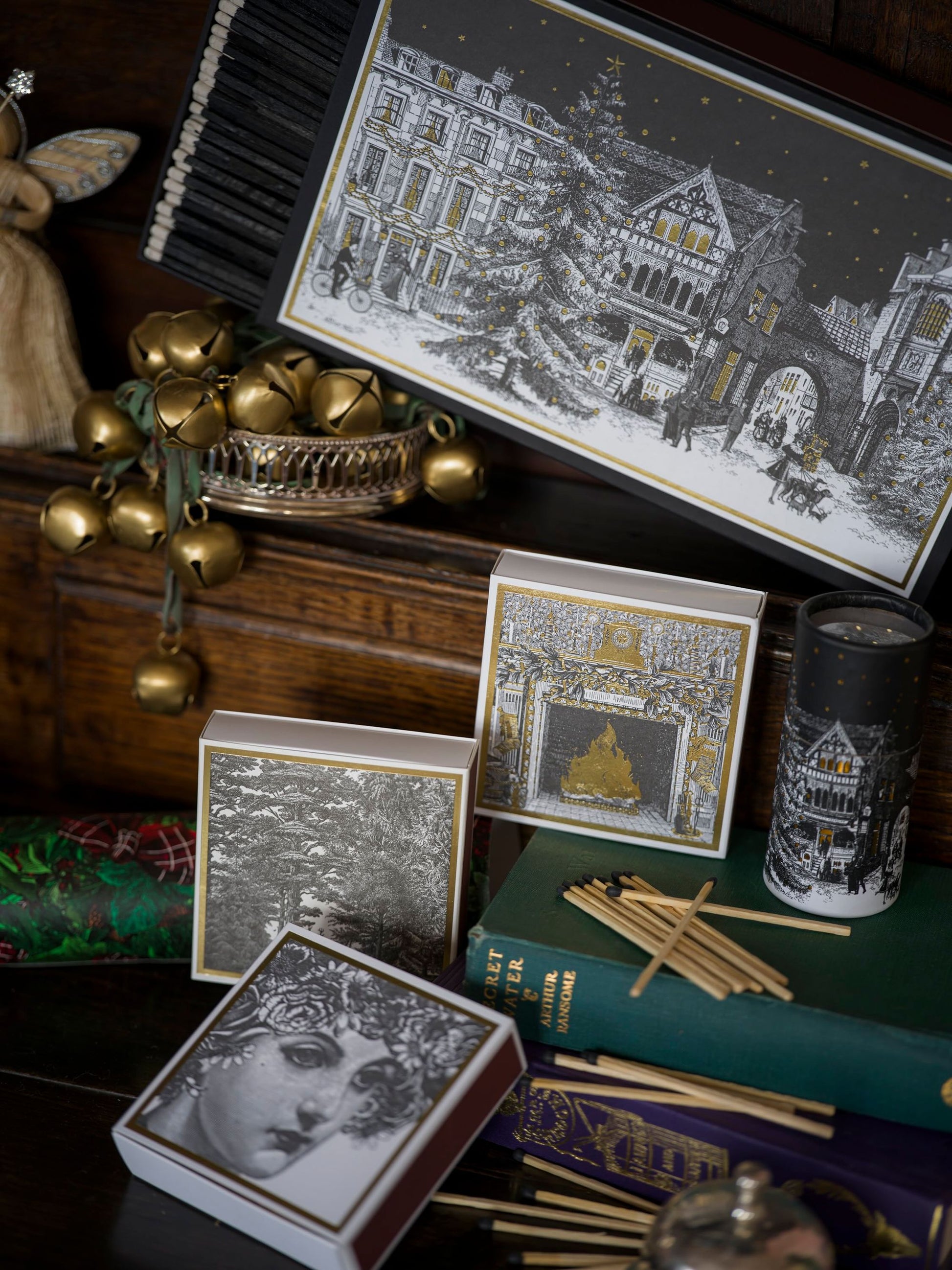 Decorative items including cards and a candle on a surface with a dark background