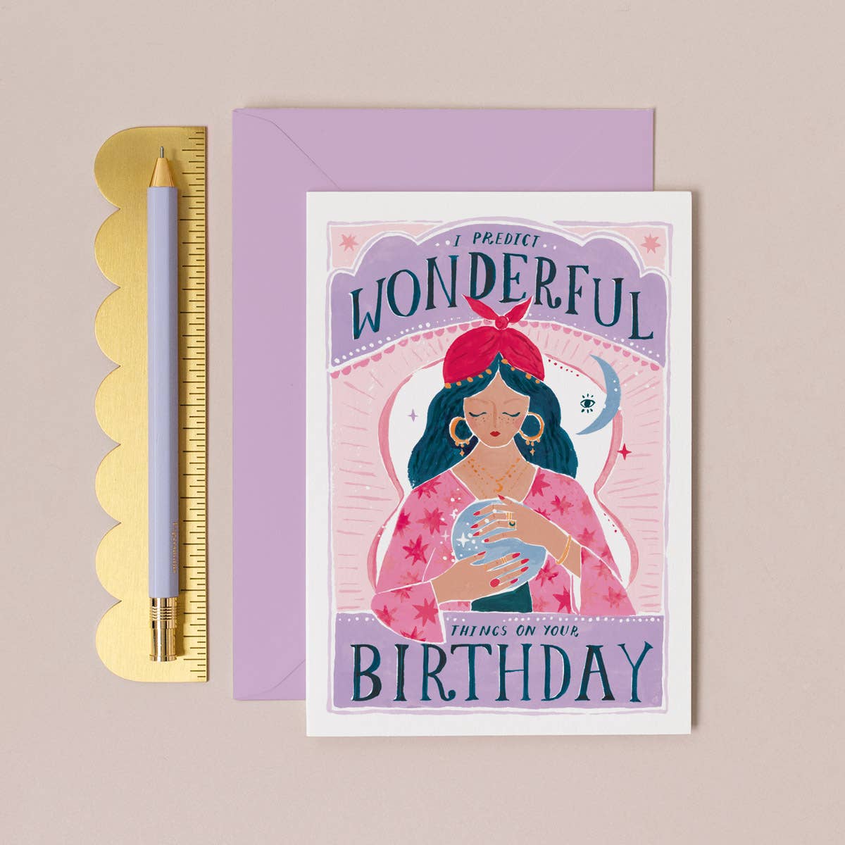 Birthday card with illustration of a woman and text 'I predict wonderful things on your birthday' on a beige background.