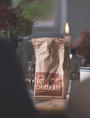 Bag of Härth Hot Chocolate on a table with blurred background