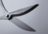 Close-up of a pair of scissors with Nakabayashi Stainless Steel branding on a gray background