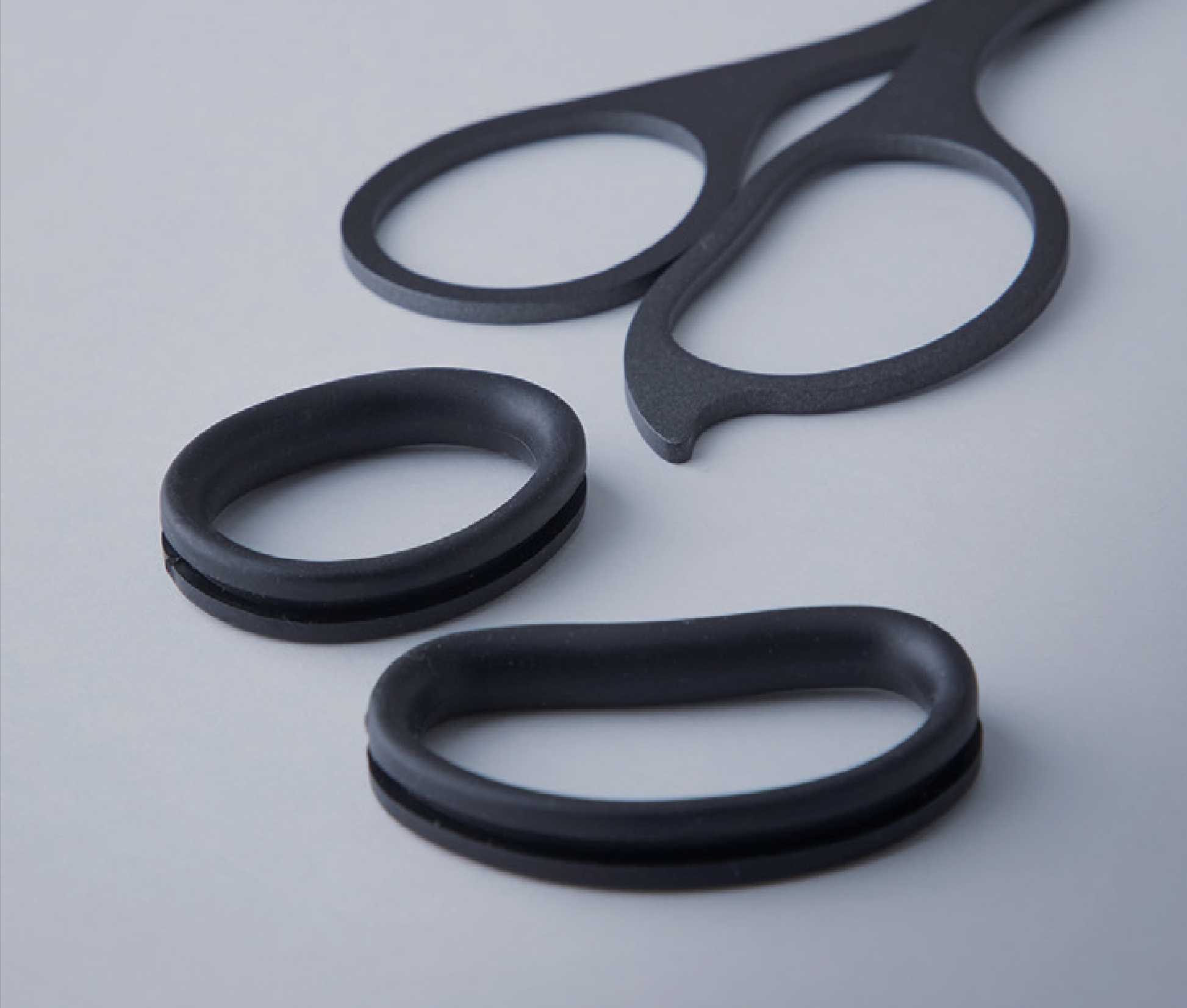 Black scissors on a light gray background