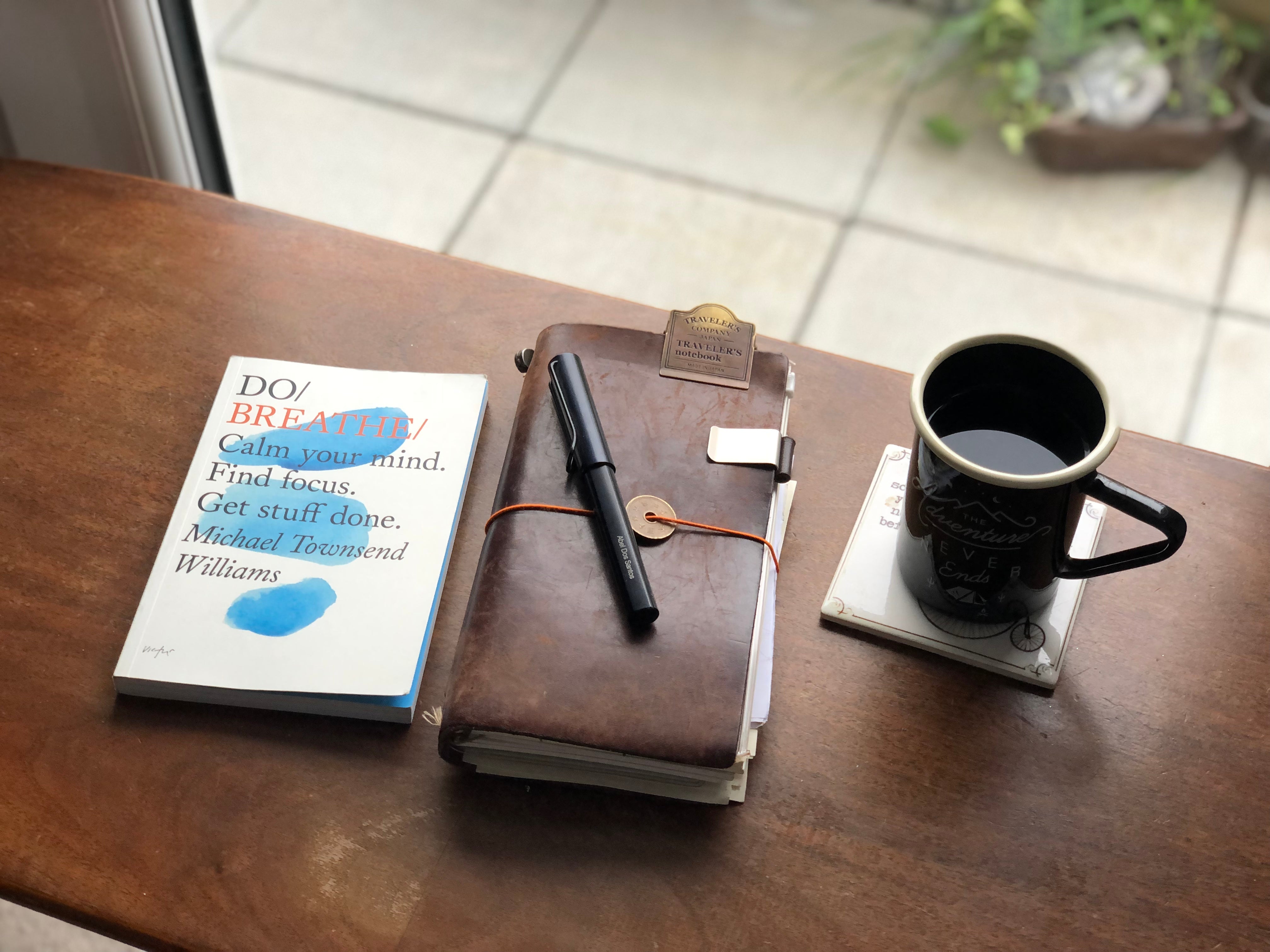 Traveler's Notebook Brown with Do Breathe book and Black coffee cup