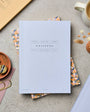 Notebook on a table with stationery items