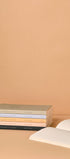Stack of books with a beige background
