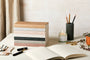 stack of Katie Leamon notebooks on a table