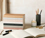 stack of Katie Leamon notebooks on a table