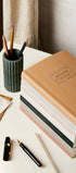 Katie Leamon stacked notebooks on desk 2