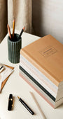 Katie Leamon stacked notebooks on desk 2