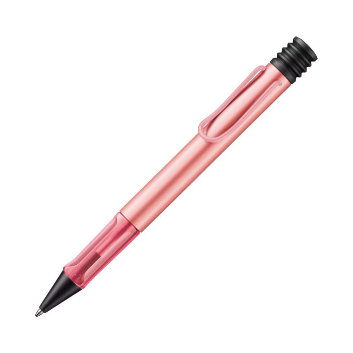 Pink pen with black accents on a white background