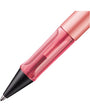 Pink pen with a black cap on a white background