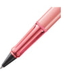 Pink pen with a black clip on a white background