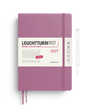 A Leuchtturm1917 2027 daily planner in dusty purple with a white paper band around the middle, shown on a white background with a pen outline to the right.