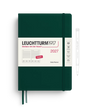 Leuchtturm1917 2027 daily planner in dark forest green with a white paper band around the middle, shown on a white background with a pen outline to the right.