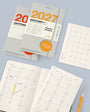 Leuchtturm1917 planner stickers and open planner on a light gray background
