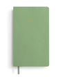 Green notebook with gold embossed text on a white background