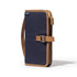 Navy blue and brown bag with a strap on a white background