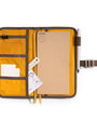 Yellow organizer with compartments and a pen on a white background