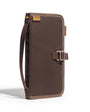 Brown bag with a strap on a white background