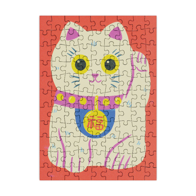 Jigsaw puzzle with a cat design on a red background