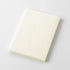 Plain white notebook on a light gray background