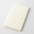 White notebook on a light gray background