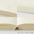Cream-colored textured notebook cover and matching lined paper pages, shown in a close-up collage with embossed 'MD' branding and the year '2027'.