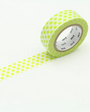 Roll of green washi tape with a dotted pattern on a white background
