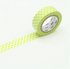 Roll of green washi tape with a dotted pattern on a white background