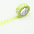 Roll of green washi tape with a dotted pattern on a white background
